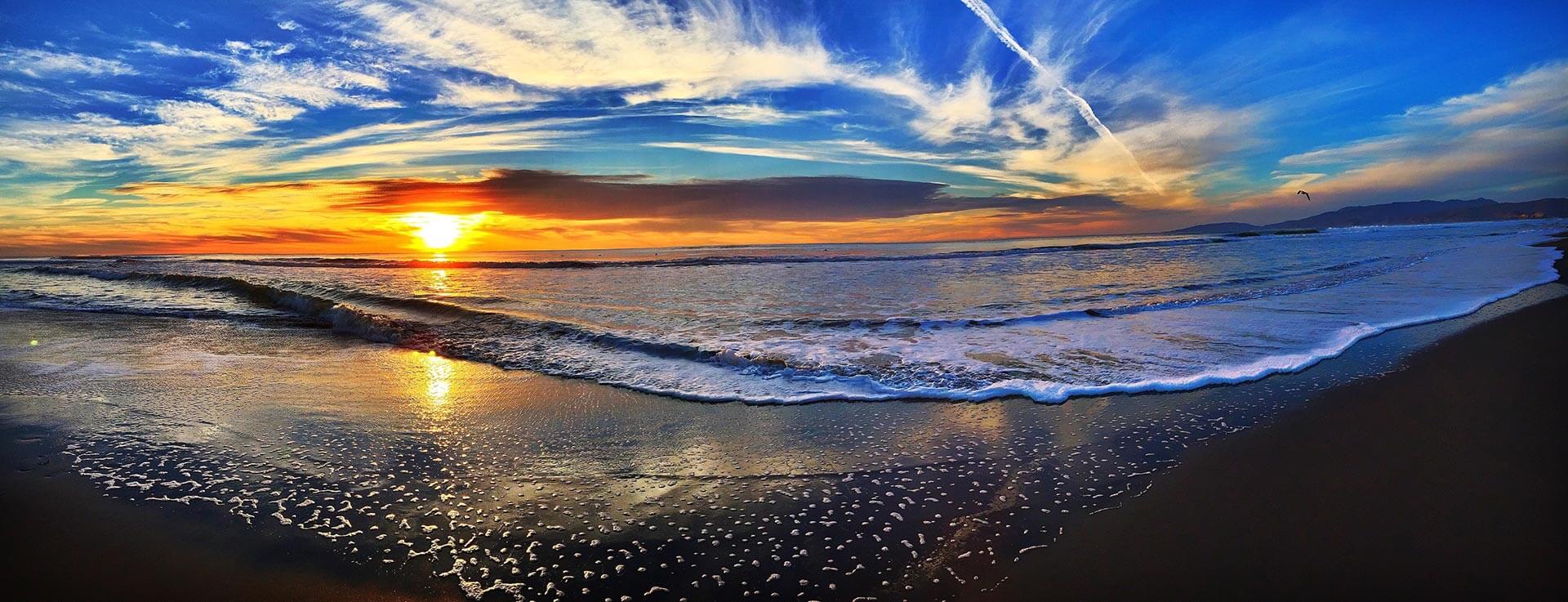 Beautiful beach at sunset with no people on it.