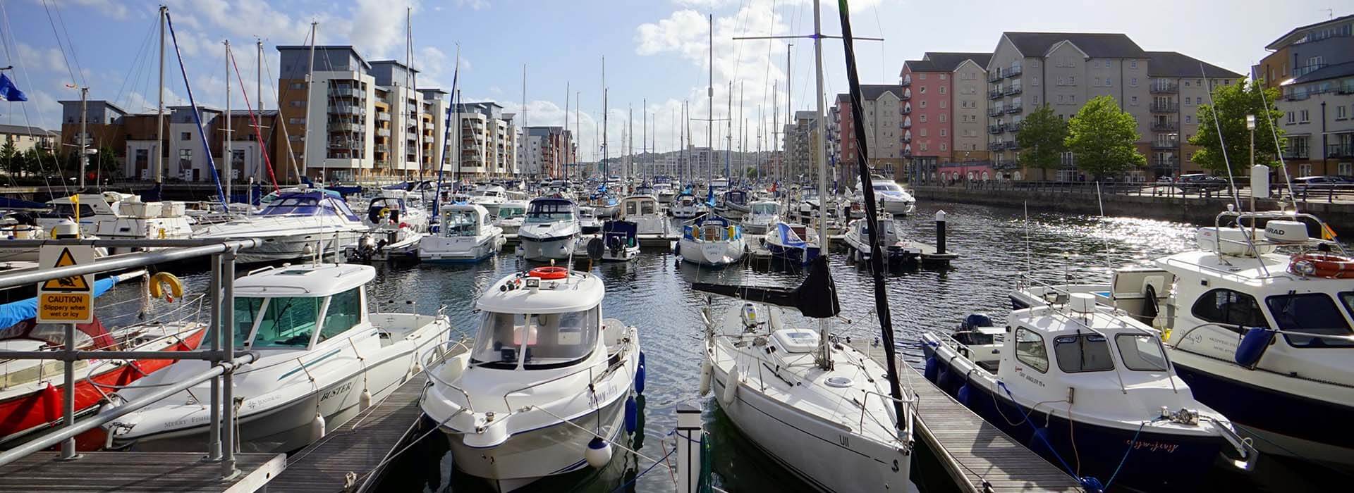 Town Marina filled with boats docked to piers clear to the horizon.